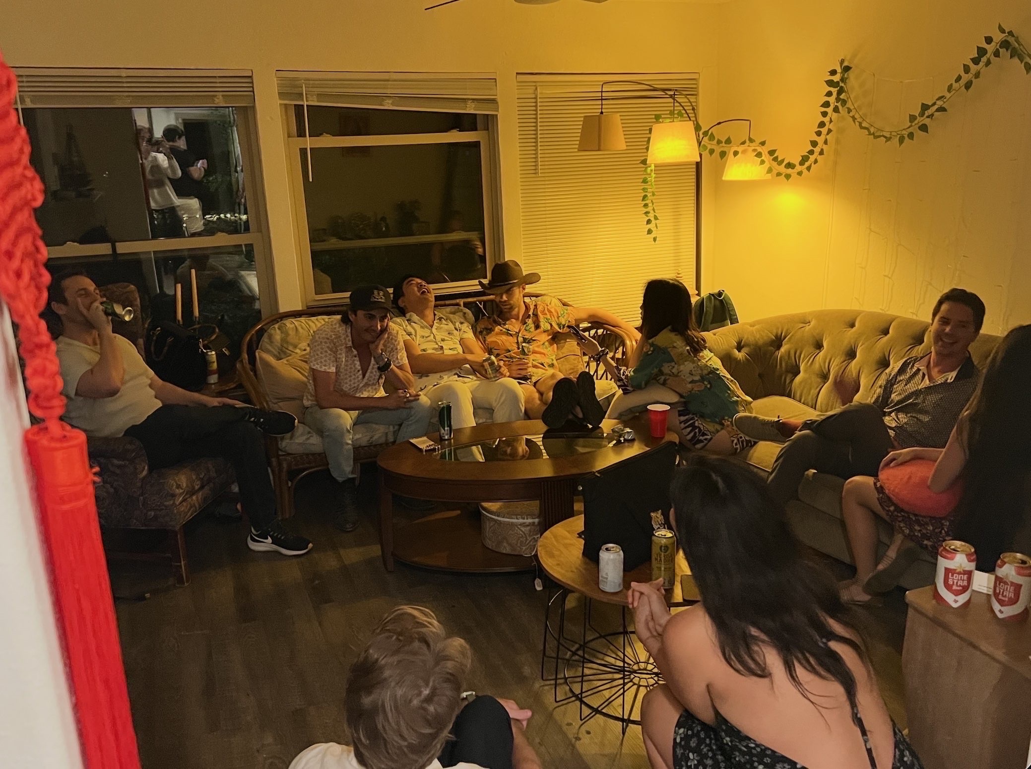 Group hanging out in the living room at a house party